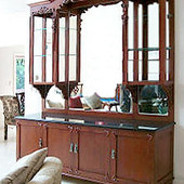 Buffet/Display Case, freestanding: stained and glazed cherry with hand carved ac
