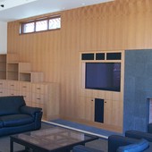 Bookcase, decorative paneling and fireplace surround:  Natural anigre.