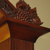 Carved grape detail of wood bar