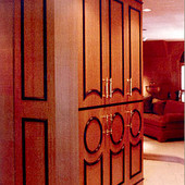 Armoire, built-in: natural anigre with black lacquer accents.