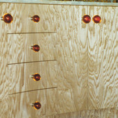 Detail:  Japanese tamo veneer with amber drawer pulls.