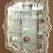 Display Cabinet, wall hung: glass, mirror, lacquered finish.
