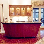 Bar, built-in: granite, glass and stained cherry.