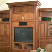 Entertainment Center, freestanding: stained and glazed maple with carved accents