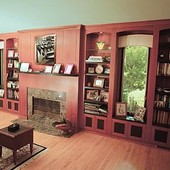 Bookcases and Fireplace Surround, built-in: granite, stained cherry with black l