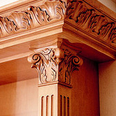Bookcase (detail), built-in: antiqued maple with carved accents.