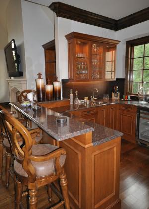 Custom kitchen cabinets with bar by Sherman and Gosweiler